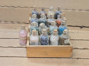 Lot of (17) Gemstone Chips in Bottles with Stand - Garnet, Red Jasper, Citrine, Black Stone, Sodalite, Blood Stone, Amethyst, Carnelian, Aventurine, Peridot, Turquoise, Rose Quartz, Iolite, Moonstone, Tiger Eye (assorted)
