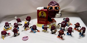 California Raisins Figure Collection with Sun-Maid Coin Bank Display & Button