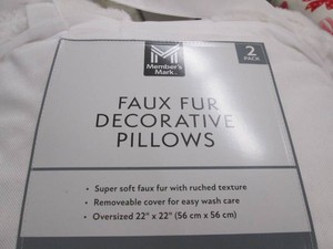 2 Faux fur decorative pillows...
