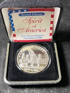 ONE TROY OZ .999 FINE SILVER 911 ROUND IN BOX