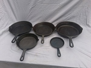 LARGE GROUP OF CAST IRON SKILLETS, INCLUDING WAGNER WARE