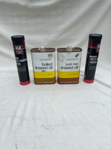2 CANS OF LINSEED OIL AND 2 TUBES OF GREASE