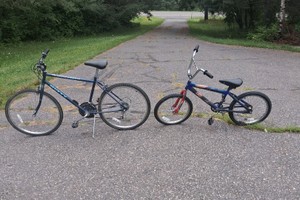 2 HUFFY BICYCLES,  ONE ADULT, ONE KIDS