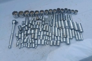 HUGE LOT OF SOCKETS AND RATCHET IN A CLEAR BIN