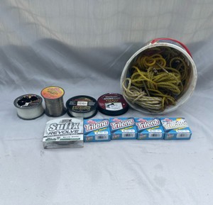 BRAND NEW FISHING LINE AND ASSORTMENT OF FISHING GEAR
