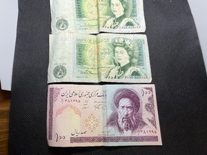 Two Iranian Bank Notes and One English Bank Note