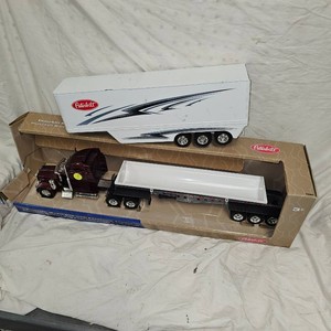 Peterbuilt 579 with Side Dump Trailer and Additional Trailer