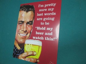 Beer metal sign measures 12 x 16 in...