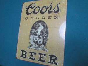 Coors golden metal sign measures 12...