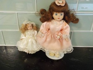 2 Porcelain Dolls...