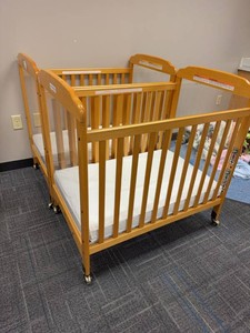 Pair of Compact Wooden Window Crib features clear acrylic panels at both ends for high visibility. Wooden Daycare Baby Cribs With Mattresses on Casters. Each Retails for $375