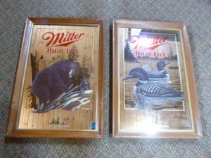Two Miller High Live Wildlife Mirrored Signs