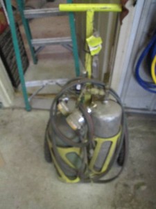 Oxygen and acetylene tanks, regulators, Smiths torch head plus cart to haul the welding set up and supplies