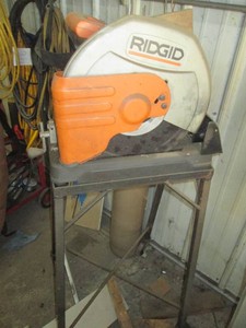 Ridgid Chop saw with metal framed portable stand
