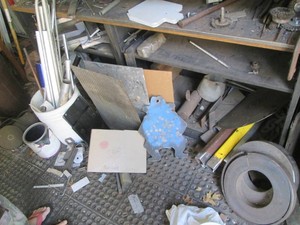 2-Long metal welding tables with content to include grinding Brushes, turnbturnbuckles, hand tools and a mass array of metal plates, pipes, Rods and misc hardware to aid with your welding projects and organization