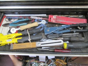 Content of toolbox drawer to include rivet guns, jab saw, pliers and more