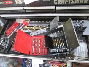 Content of toolbox drawer to include a large assortment of drill bit indexes, router bits and other misc