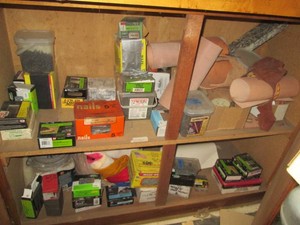 Lower Cabinet content consisting a massive supply of construction hardware and components