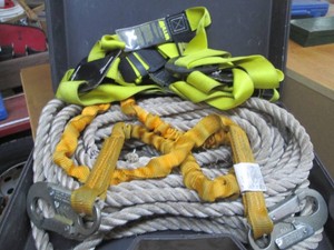 Hardside case containing tow straps and rope