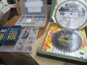 Hardware organizers with misc bits and construction hardware, drill bits and wood case with saw blades