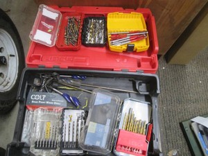Milwaukee hardside case with a large assortment of drill bits