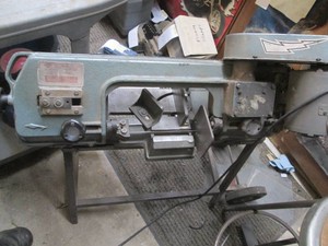Bell metal cutting band saw with metal portability cart