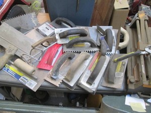 Heavy duty floor and wall tile cutter with various sheet rockmasonry tools