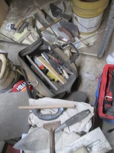 Large tool bag with drywall and masonry tools and plates crate with drop cloths