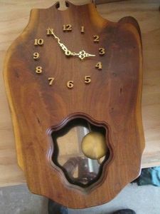 Homemade wood slab pendulum wall clock