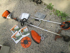Stihl gas power head with weed eater and edger attachments and misc accessories