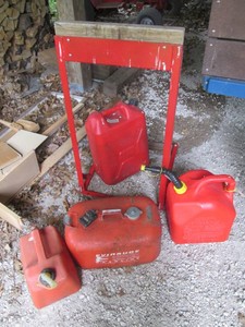 Metal framed outboard engine stand, plastic gas can variety and Evinrude metal gas can