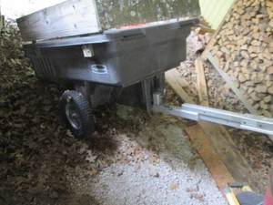 Plastic tow along Rubbermaid dump trailercart