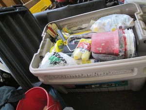Rubbermaid Action Packer full of painting tools and supplies