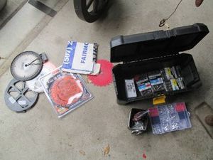 Plastic Stanley toolbox with fasteners and construction hardware plus misc circular saw blades