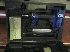 Pneumatic stapler in case with accessories