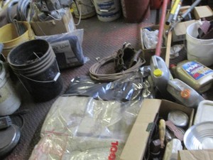 Tarps, hand siphon, automotive fluids, caulking gun, pipe wrench, channel lock, fasteners and construction hardware plus other misc