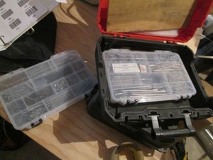 Milwaukee hardside case containing hardware organizers with misc hardware
