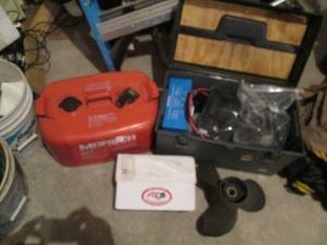 Marine supplies to include a starter, gas can, propeller and toolbox full of wiring and other misc