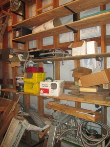 Garage shelf contents to include part organizer bins, electric cooktop, storm seal, chicken wire fencing and other misc shown