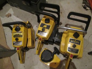 Trio of incomplete McCullough chainsaws for parts or repair