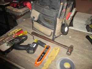 Top handle tool caddy with a variety of hand tools, nut drivers and more