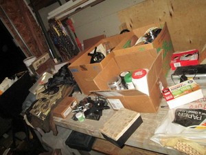 Content on tabletop to include misc kitchen supplies, glassware, electronic supplies, hunting gear , protective face shields and more