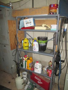 5-tier metal storage shelf with content including outdoor chemicals, household cleaners, fishermans bait gear and more