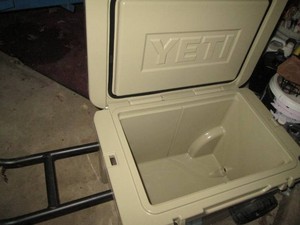 Portable Yeti insulated cooler with wheels and handle