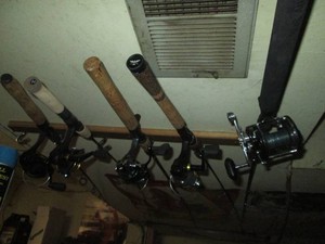 Assorted Fishing poles with reels by Penn, Regal and Mitchell