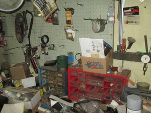 Benchtop content including multi-drawer organizers, bench vise, misc hand tools, battery tester, fasteners and other hardware plus additional items shown