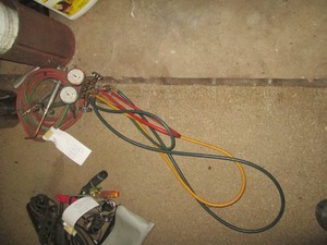 Smiths cutting torch heads, hoses and fire extinguishers