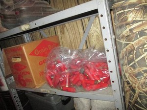 Metal storage shelf, hunting hunting jackets, winter boots, shotgun shell casings, ducks unlimited waders, clothing rack and more