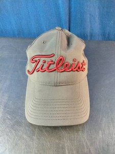 Grey Titleist Pro V1 golf cap featuring a prominent red FootJoy (FJ) logo on the side.