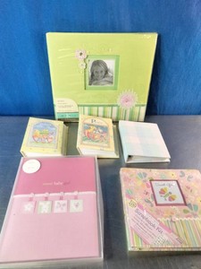 Collection of baby memory books and scrapbook albums,